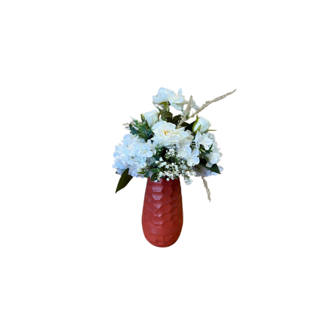 Bouquet éclatant dans un vase rouge texturé